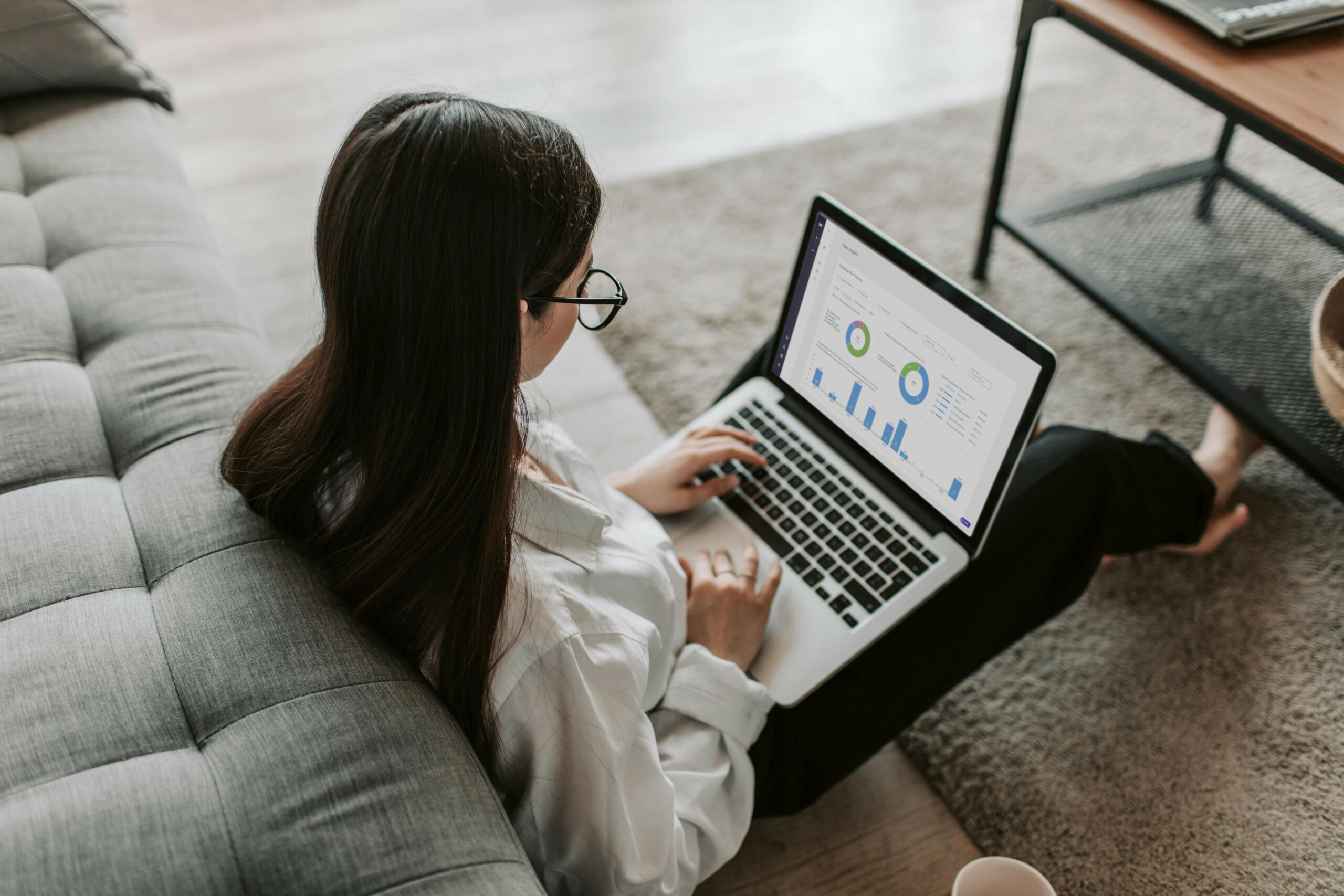Weavr announces new data insights dashboards in embedded finance portal (illustration: a software user browses Weavr embedder finance insights dashboard on their laptop)